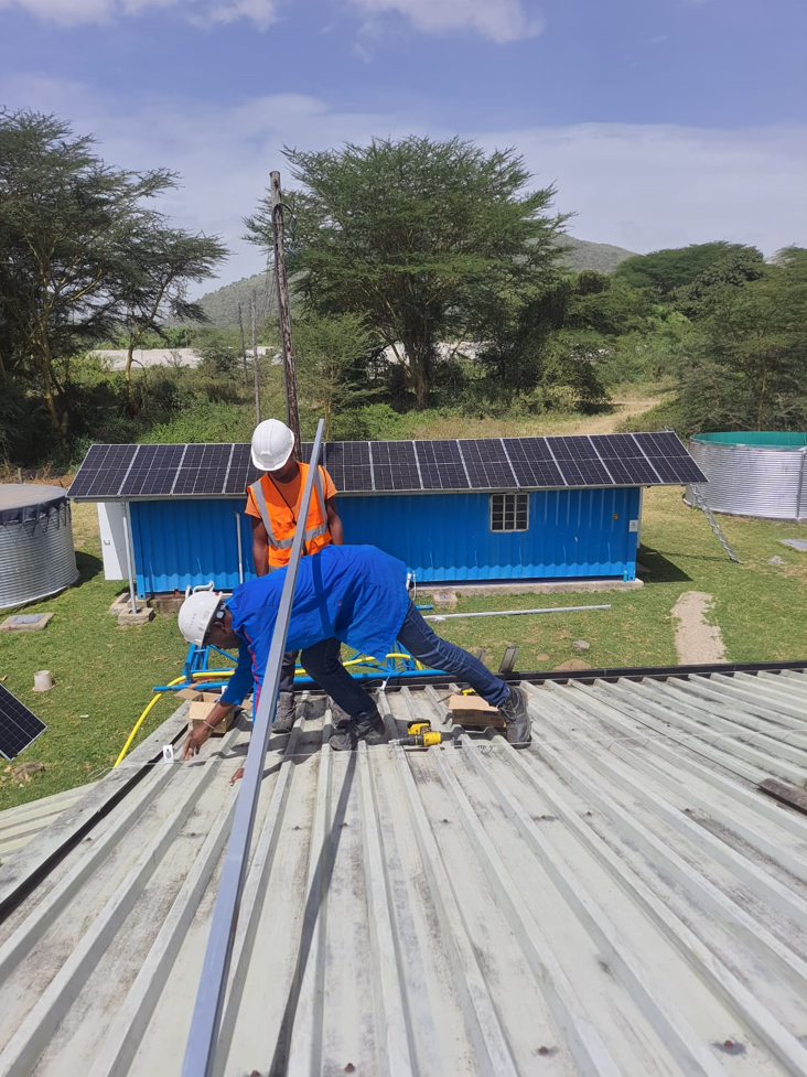 technicians working on the roof